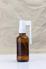 throat spray, medicine for sore throat, in a glass spray bottle