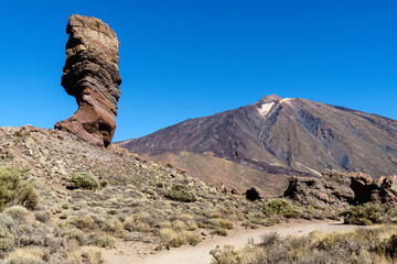 Roque Cinchado in front of Snow Capped Volcano Teide