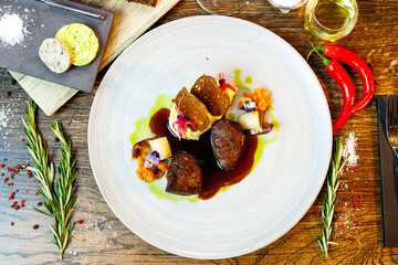 Deer tenderloin. Truffle-potato puree, porcini mushrooms, baked leek and carrot, juniper bread, port wine sauce. Delicious healthy traditional food served for lunch in modern gourmet restaurant