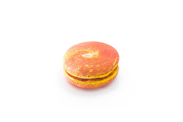 Orange French macaroon isolated on white background. Tasty colorful macaroons. French pastry made from egg whites. Culinary and cooking concept.