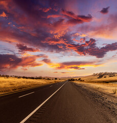 Obraz na płótnie Canvas Empty asphalt road at sunset