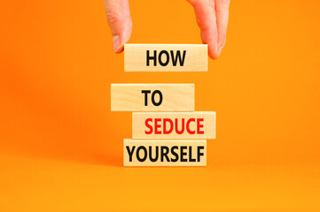 How to seduce yourself symbol. Concept word How to seduce yourself on wooden blocks. Businessman hand. Beautiful orange table orange background. Business and how to seduce yourself concept. Copy space