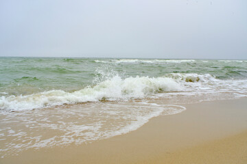 Beach Baltic Sea coast with quartz sand and rolling waves.