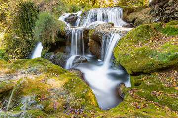 Fototapeta na wymiar Scenic view of waterfall in Provence south of France in warm autumn light