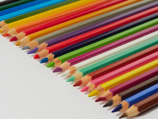 Colored pencils background. Colored pencils on a white background.