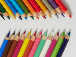 Colored pencils background. Colored pencils on a white background.