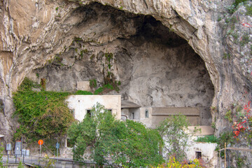 Buildings in a big cave, near Amalfi village. Italy