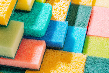 cleaning sponge background. sponges for cleaning different colors and different sizes - obrazy, fototapety, plakaty