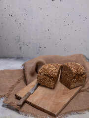 Freshly baked bread on grey concrete background. 