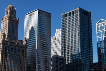 Fototapeta na wymiar Tall Office Skyscrapers in Downtown Chicago with a Blue Sky