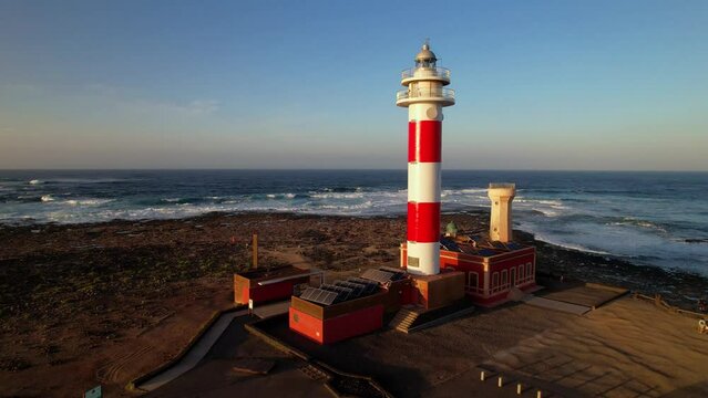 Marine landscape with lighthouse over sunset. aerial drone view, Fuerteventura . Canary island, El Cotilio village. El Toston lighthouse