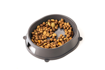 Food for cats and dogs in a bowl on a white background.	