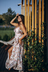 Woman in beautiful summer dress in park