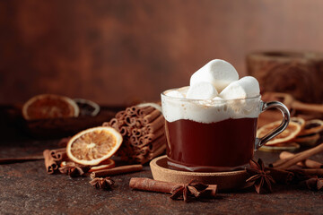 Hot chocolate with marshmallows on a dark brown background.