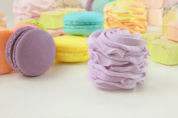 Various of sweets: macaroons, marshmallows and zephyrs. Homemade colored desserts for the present.