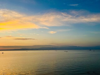 Obraz na płótnie Canvas Seascape after the sunset, orange clouds at the seascape, golden hour