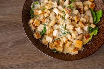 Healthy, delicious fresh juicy ready to eat Caesar salad with chicken, bread crouton, salad leaves, lettuce. Copy space