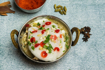 Kashmiri Chicken karahi with onion and chili served in a dish isolated on grey background top view of bangladesh food