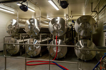 Modern interior of a brewery containing stainless steel