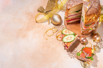 Christmas panettone gastronomico. Pan Brioche salato Panettone gastronomico Italian Christmas, New Year antipasto appetizer sandwiches, with sausage, meat, cheese, olives, salmon fish