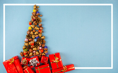 happy  New Year Merry Christmas card with Christmas tree made from painted acorns and space for...