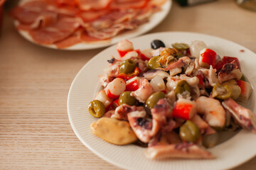 Seafood salad on a table. Tradition of eating seafood for Christmas in Spain. 
