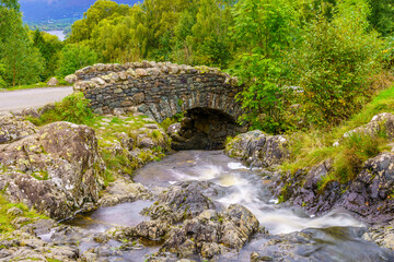 Fototapeta na wymiar Ashness Bridge, traditional stone-built bridge, the Lake District