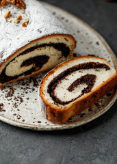 Christmas poppy seed cake. Poppy roll on dark background