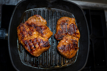 Seasoned sirloin steak on a grill pan. steak large. Selective focus