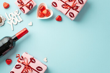 Fototapeta na wymiar Valentine's Day concept. Top view photo of gift boxes heart shaped saucer with chocolate candies wine bottle and inscription love you on isolated light blue background with copyspace