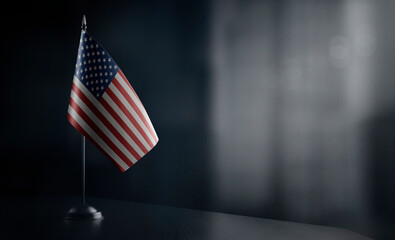 Small national flag of the United States on a black background