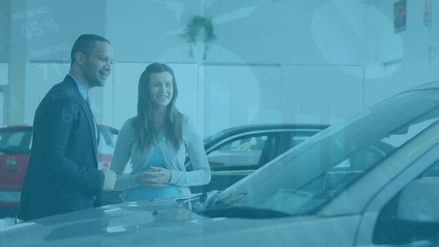 Animation of data processing over caucasian woman with businessman in car salon