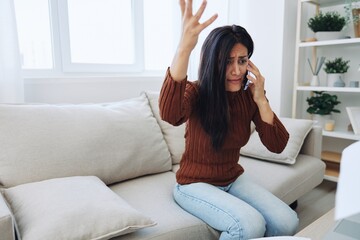 Woman talking on phone angry and sad at home, fight over phone throwing papers, bad news at work and family