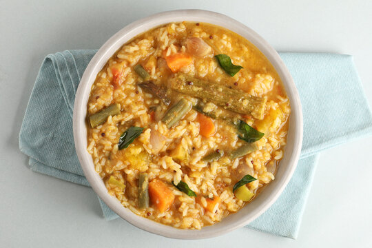 South Indian traditional and popular vegetarian rice dish, bisi bele bath, which has rice and pigeon pea as the main ingredients.