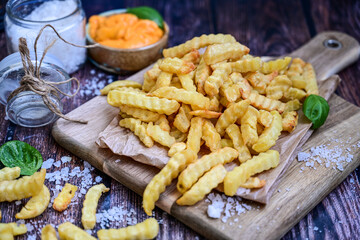 Home made   organic   Fresh fried French fries with ketchup sauce  on wooden background