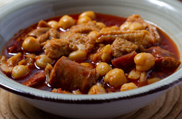 Caloric dish of traditional Spanish cuisine. Winter food. Madrid style tripe stew.(Callos a la madrileña)