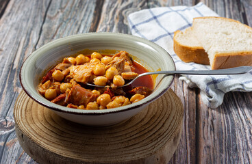 Caloric dish of traditional Spanish cuisine. Winter food. Madrid style tripe stew.(Callos a la madrileña)