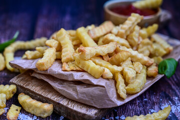  Home made   organic   Fresh fried French fries with ketchup saue  on wooden background