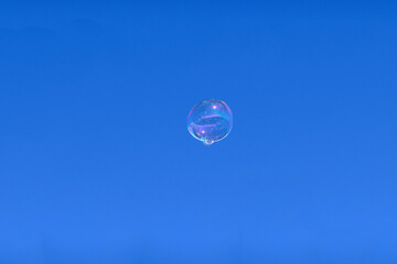 Soap bubble against blue sky