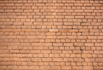 Fototapeta premium Old red wall from brickwork as background horizontal view closeup