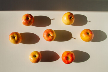 Set of apples. Apples are yellow-red. Hard light.