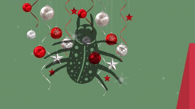 Animation of spider and baubles over snow falling
