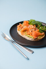 Bruschetta with salmon on a blue background. A restaurant that serves food. food photo