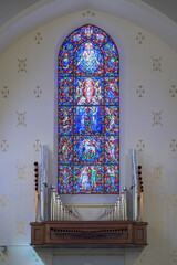 Stained glass windows above pipe organ at the rear of the historic Cathedral of St. John in downtown Albuquerque, New Mexico