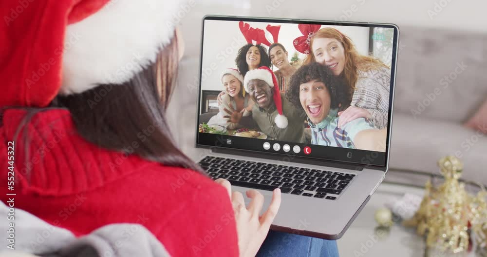 Sticker Animation of caucasian woman in santa hat on laptop video call with friends at christmas