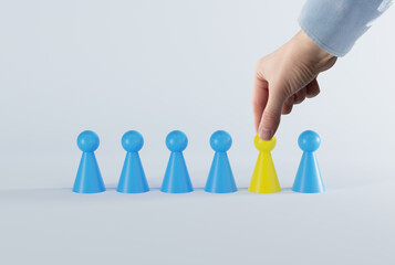Yellow and blue pawns. Diversity, racism and discrimination issues concept. Creative activities and...