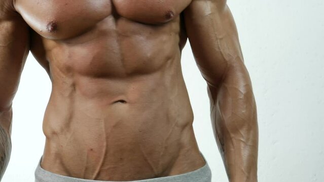 Muscular bodybuilder man shirtless in studio