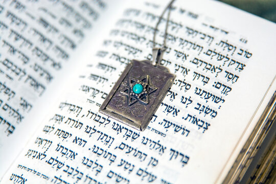 Star David Amulet  pendant on old paper page background  Star of David necklace, Magen David
