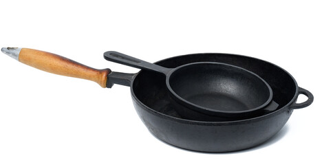 Empty black round metal pan on a white isolated background