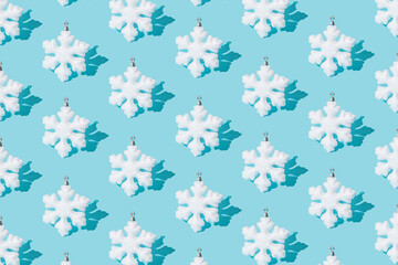 Snowflake on ablue background. Pattern. Minimal design.